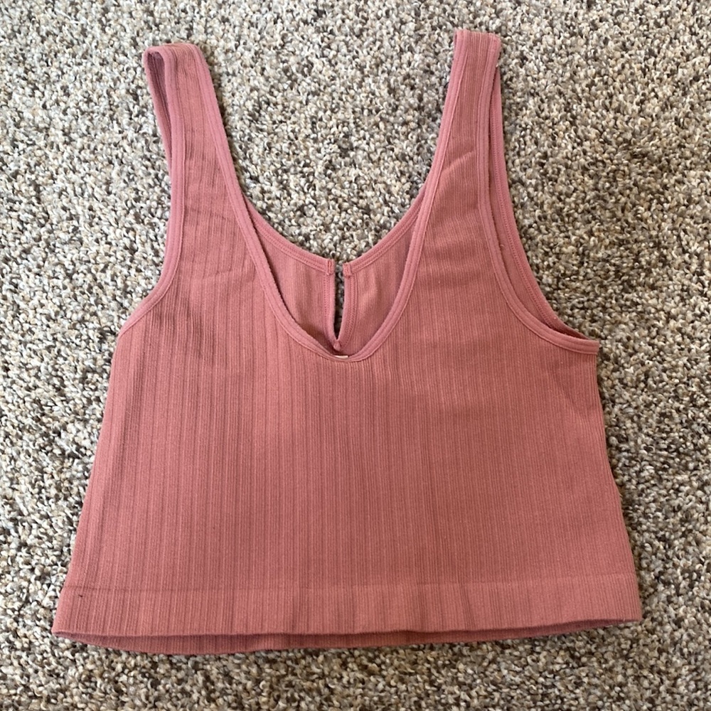 It’s a pink crop top and it’s a size small. - Picture 2 of 2